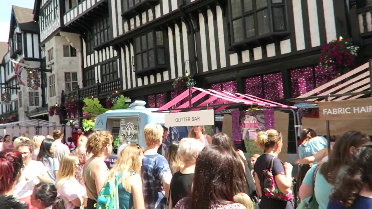 Crowds beside Liberty and outdoor stalls in summer 2016