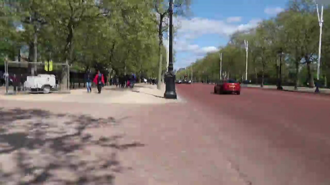 The red road of The Mall leading from Buckingham Palace towards Admiralty Arch