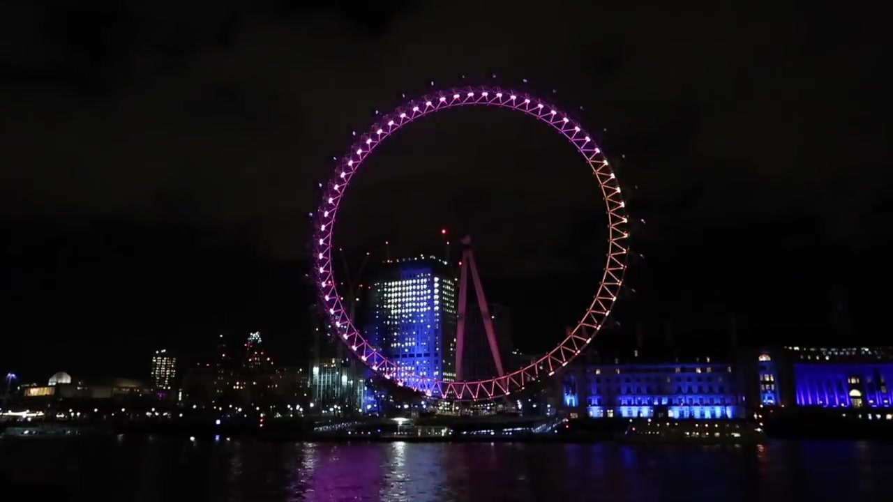 The illuminated London Eye towards the end of the retrospective.