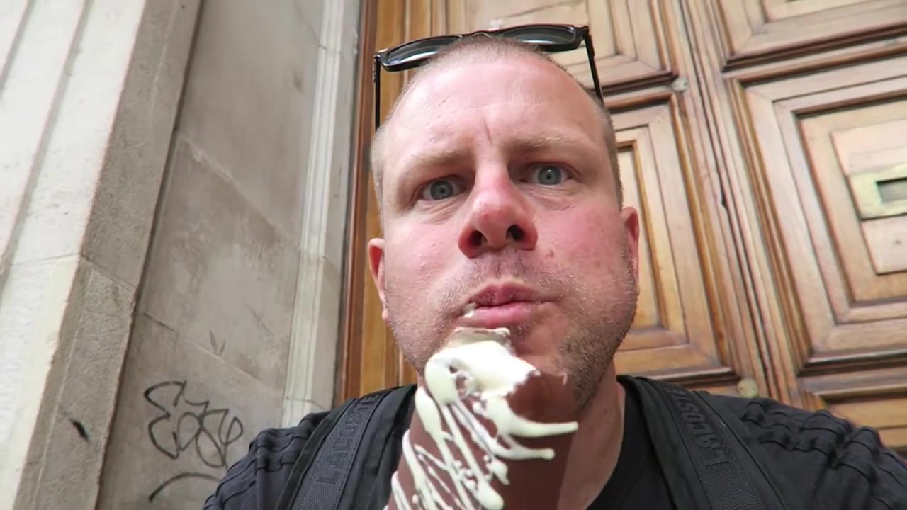 Barry Roberts tasting his hand-dipped Magnum on Regent Street