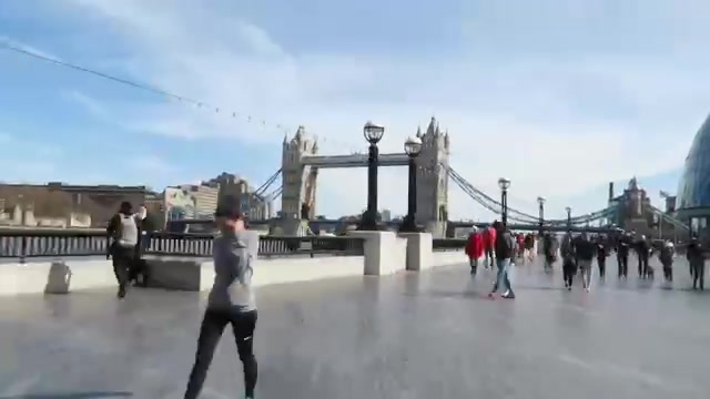 Tower Bridge seen from the broad riverside walkway on the south bank
