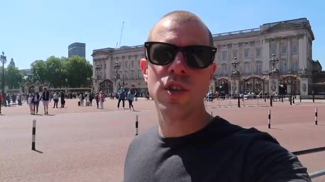 Visitors gather outside Buckingham Palace while the wedding takes place in Windsor.