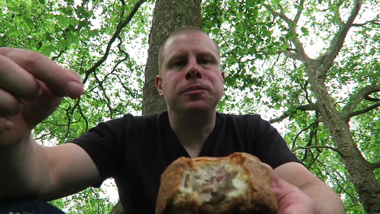Barry Roberts showing the pork pie filling during his Green Park picnic
