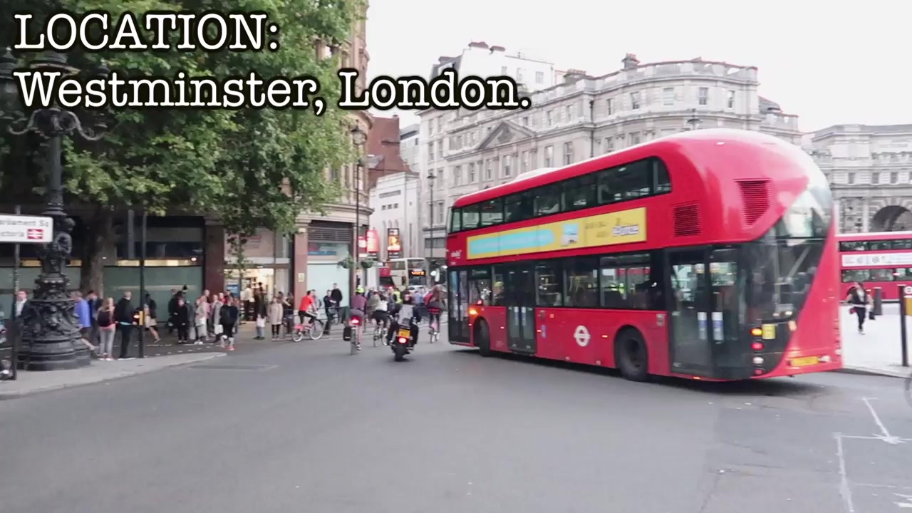 A red London bus passes through Westminster in the film’s opening sequence.