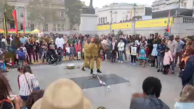 An outdoor performance surrounded by visitors at Africa on the Square 2017.