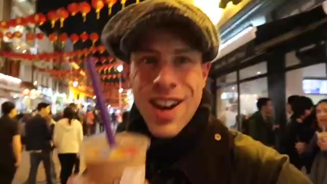 Barry with bubble tea in Chinatown after dark.