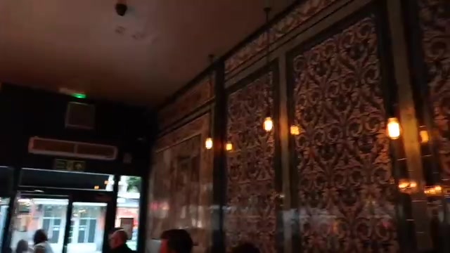 Decorative tiled walls inside the Ten Bells pub in Spitalfields.