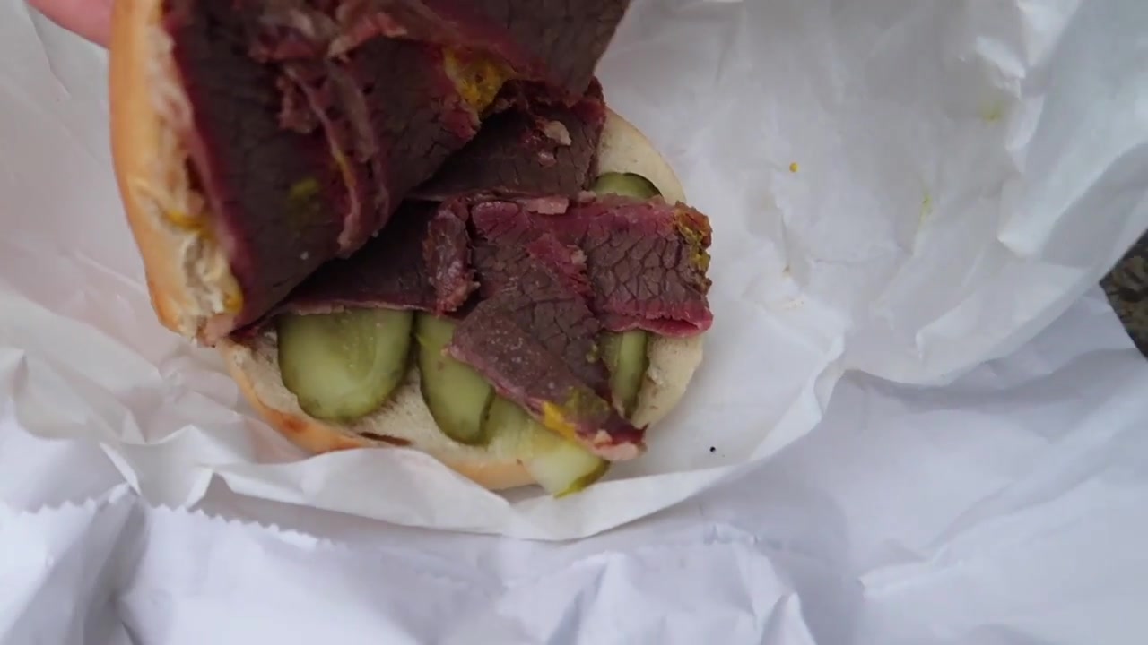 Salt beef, pickles and mustard inside the bagel from Gaby’s Deli.
