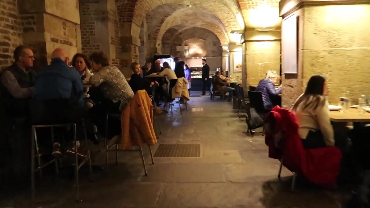 The busy vaulted dining area at Café in the Crypt.