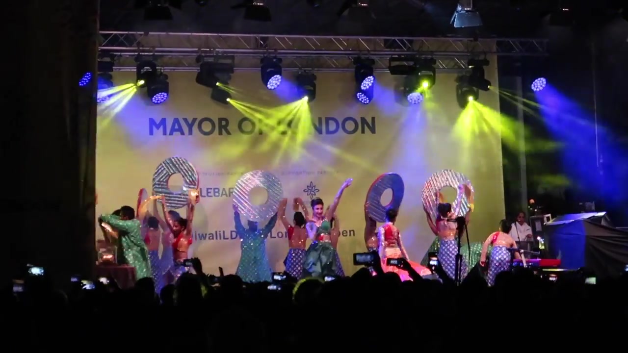 Dancers on stage as Diwali in Trafalgar Square continues after dark.