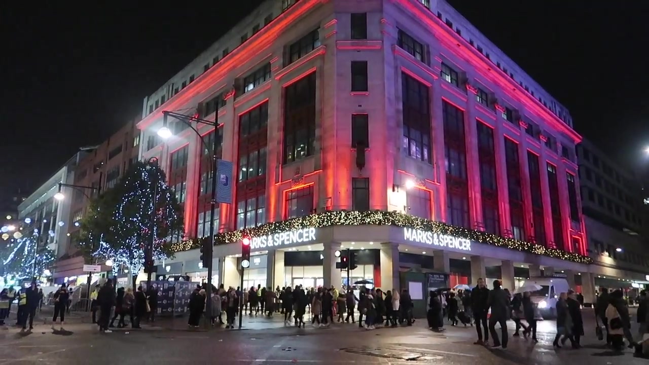 The Marks & Spencer building illuminated in red and pink after the switch-on.
