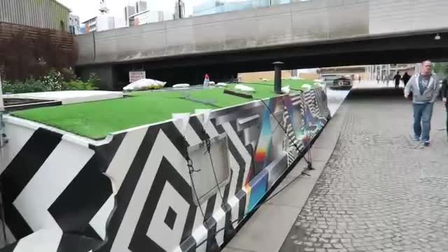 Canal boat beside the towpath and bridges near Paddington