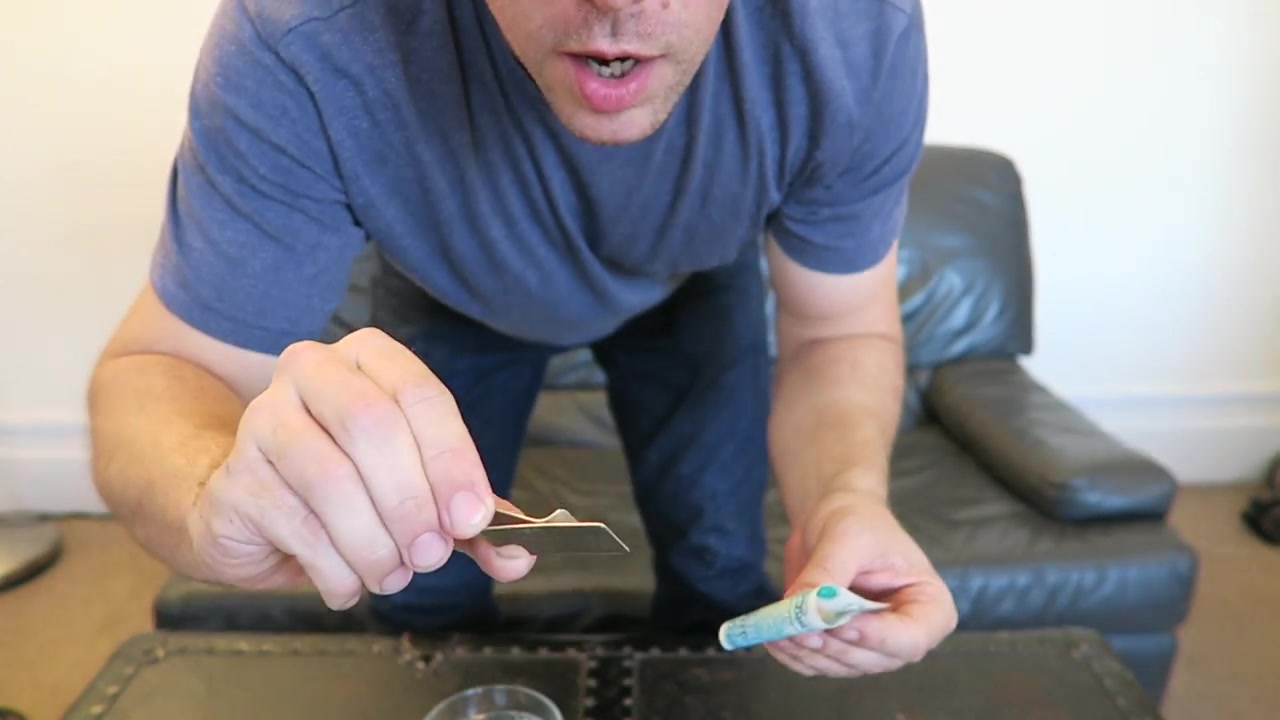 Barry holds the polymer fiver towards the camera near the end of the film