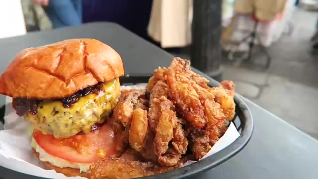 Cheeseburger and plantain fries served at Boom Burger