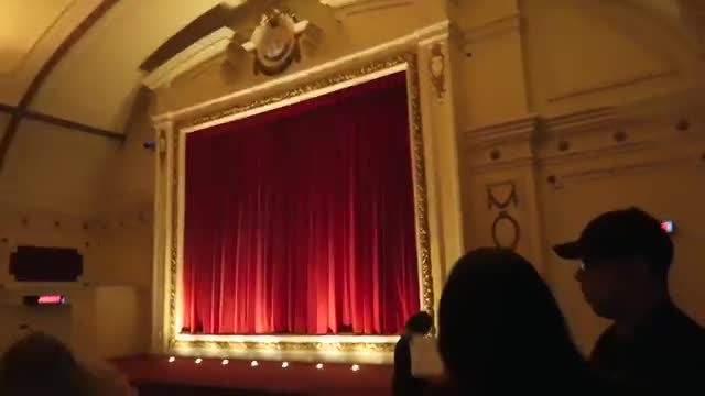 Red curtains and ornate gold decoration inside the Electric Cinema