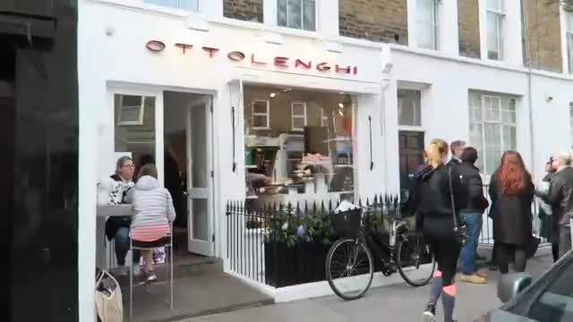 White Ottolenghi shopfront with visitors outside