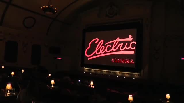 The Electric Cinema name glowing on the auditorium screen