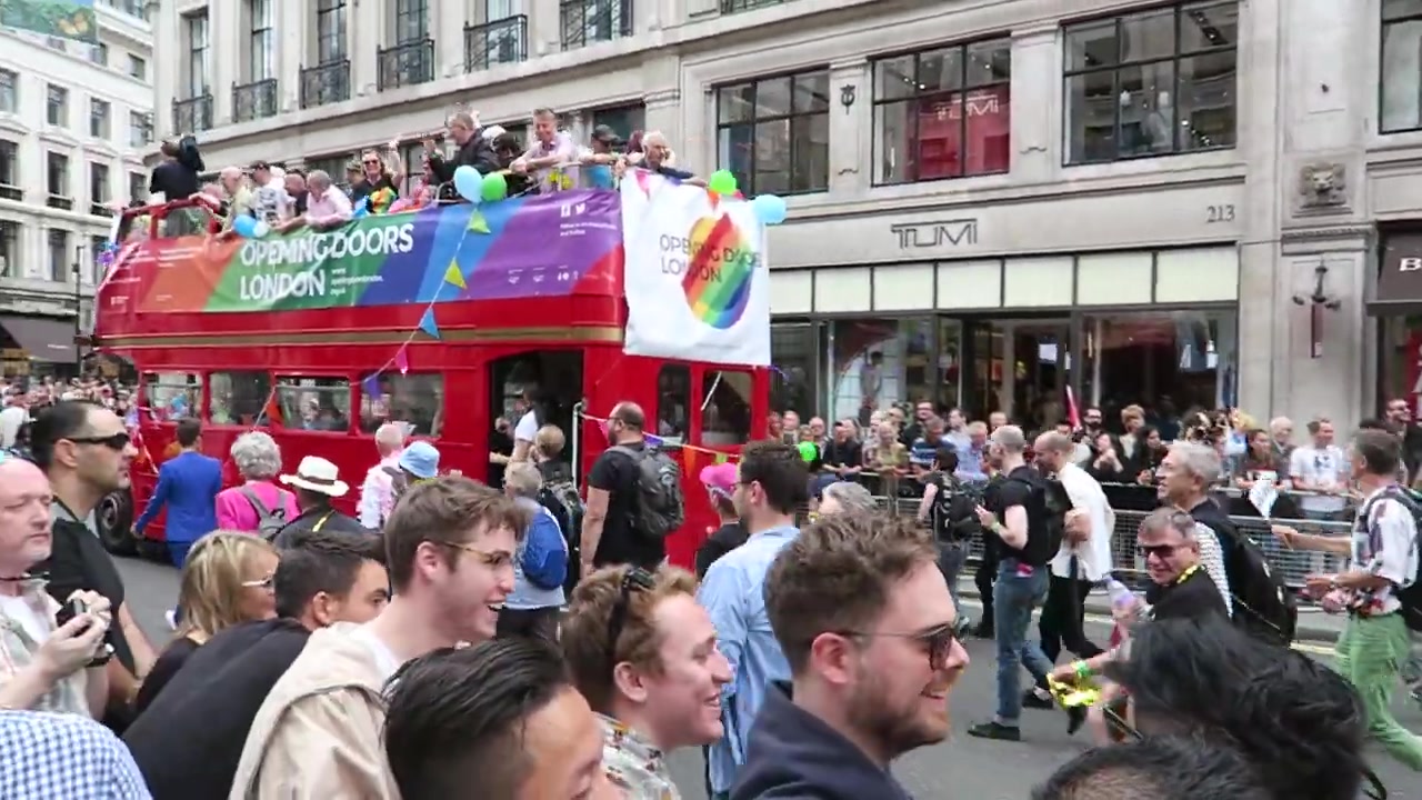 Opening Doors London rainbow banner on a red bus at Pride in London 2016