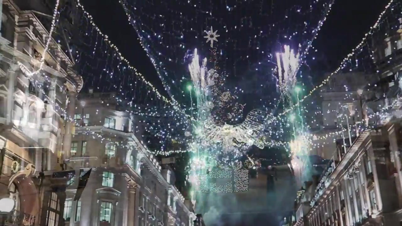 Green and white fireworks rise above the angel lights at the 2017 switch-on.
