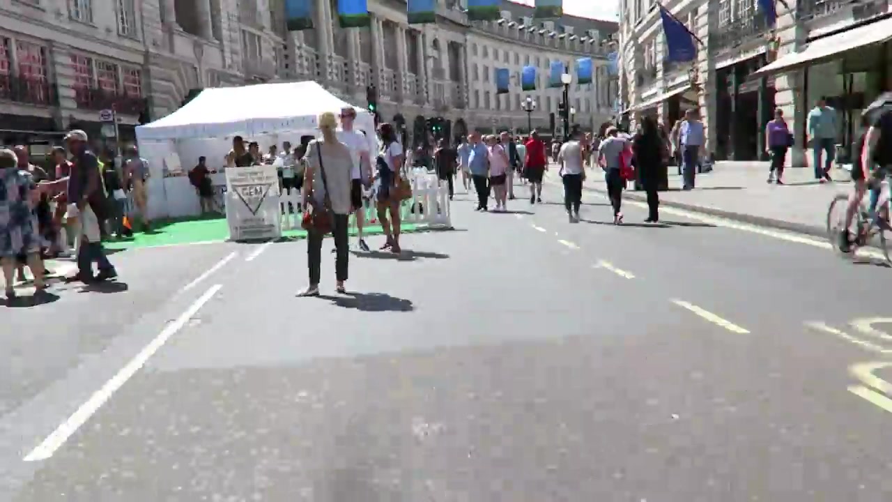 People strolling through the open roadway during Summer Streets