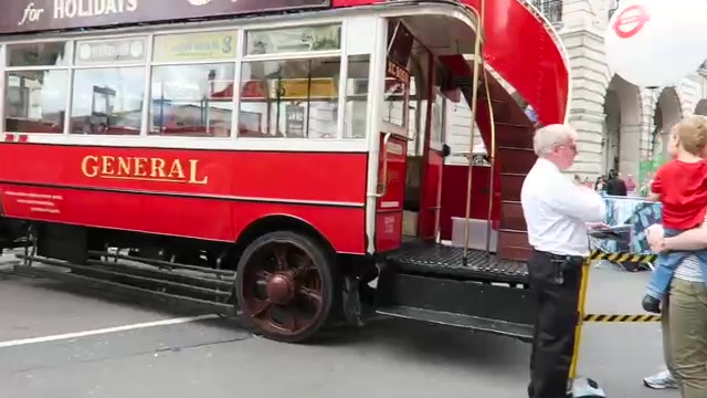 Red GENERAL heritage bus displayed on Regent Street