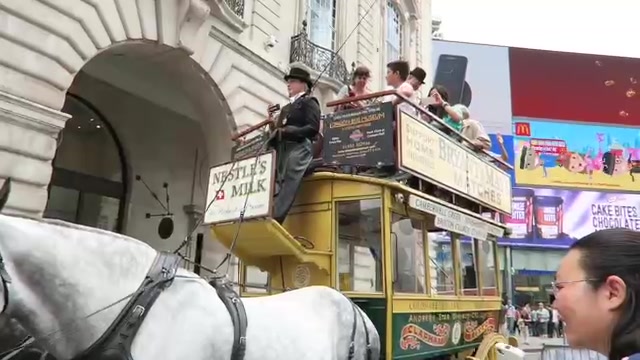Horses beside a historic open-top horse bus at Regent Street Summer Streets