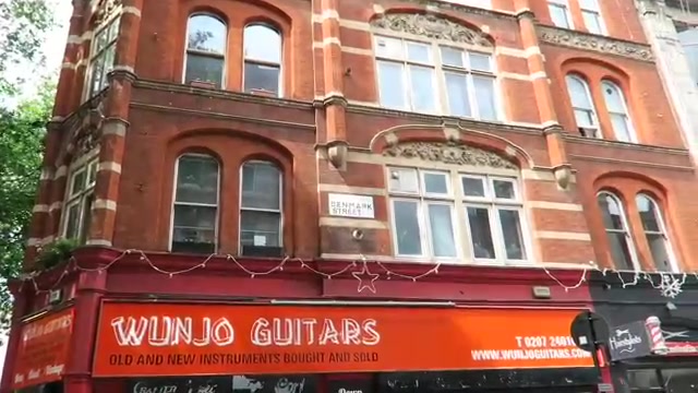 Guitar shops and red-brick buildings on Denmark Street in 2016