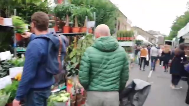 Shoppers and flower stalls along Columbia Road in London
