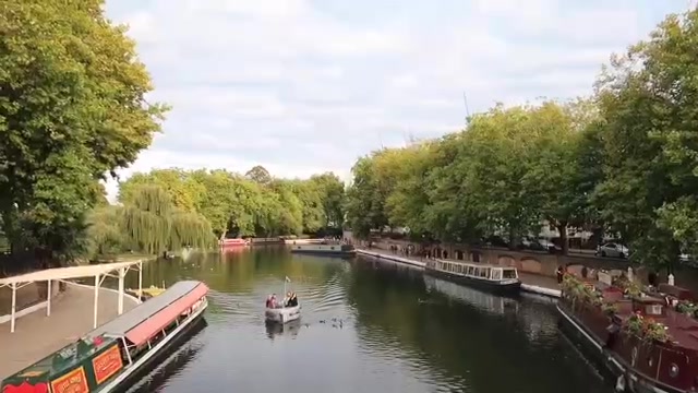 Canal boats and tree-lined water at Little Venice in September