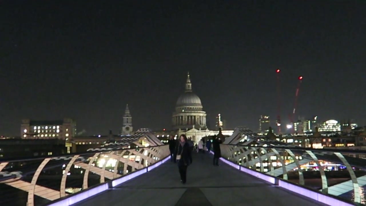 St Paul’s Cathedral seen from the illuminated Millennium Bridge at night in December 2016