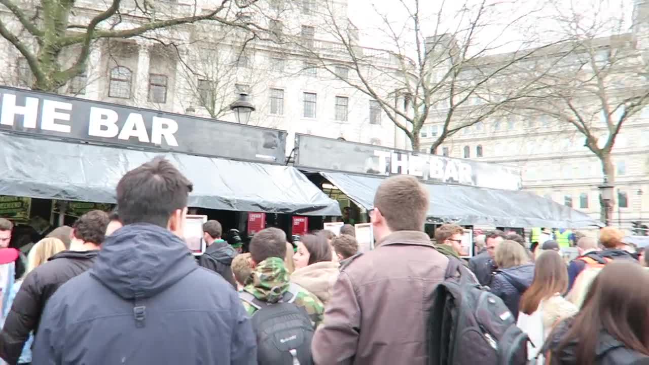 Visitors gathered beneath The Bar sign at the festival
