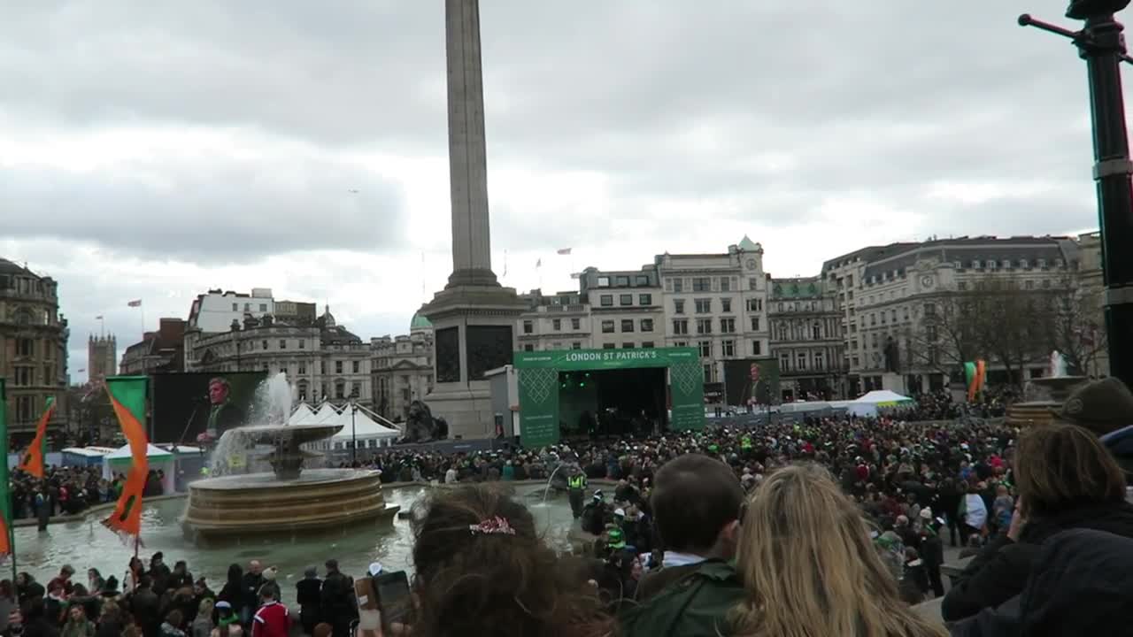 Crowds around a Trafalgar Square fountain and the festival stage