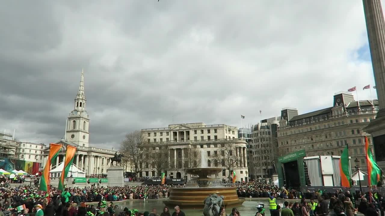 Festival crowds and Irish flags with St Martin-in-the-Fields beyond