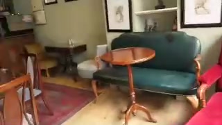 Vintage chairs and small tables inside Cafe 10 Shepherd Street
