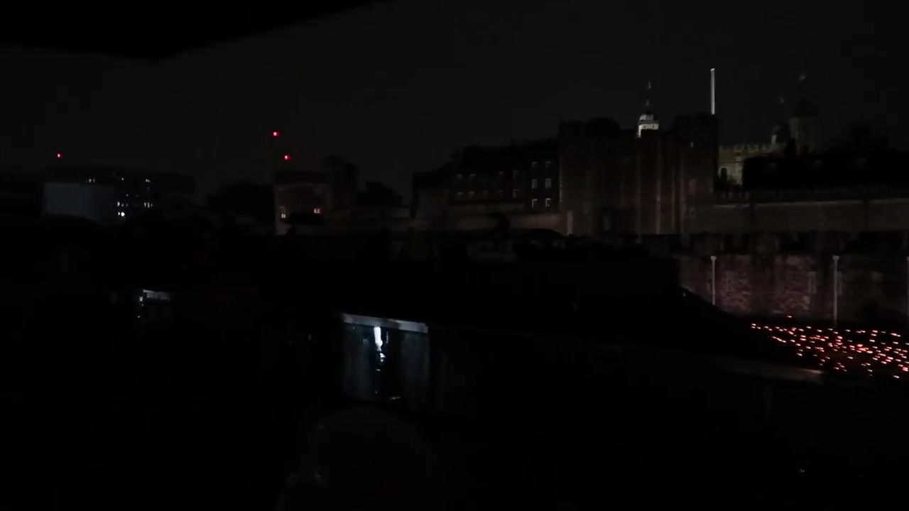 Rows of flames beneath the Tower of London walls in November 2018