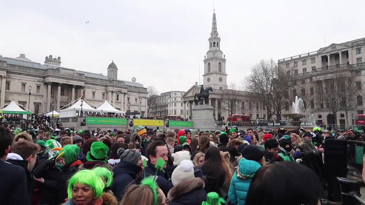 The festival crowd and green stage beneath Nelson’s Column.