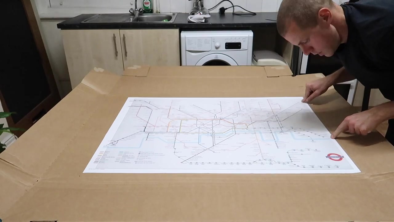 Barry pointing out the edge of the Tube map before trimming it
