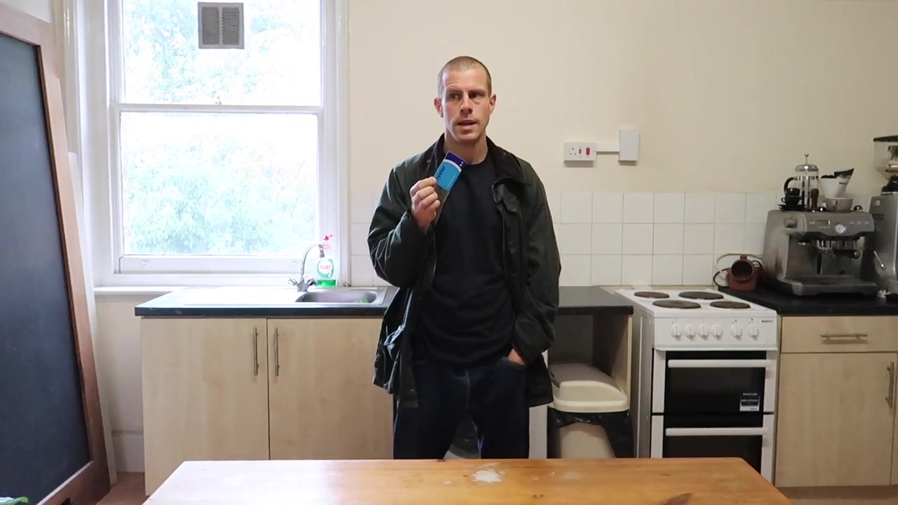 Barry holding an Oyster card at home in the 2017 film