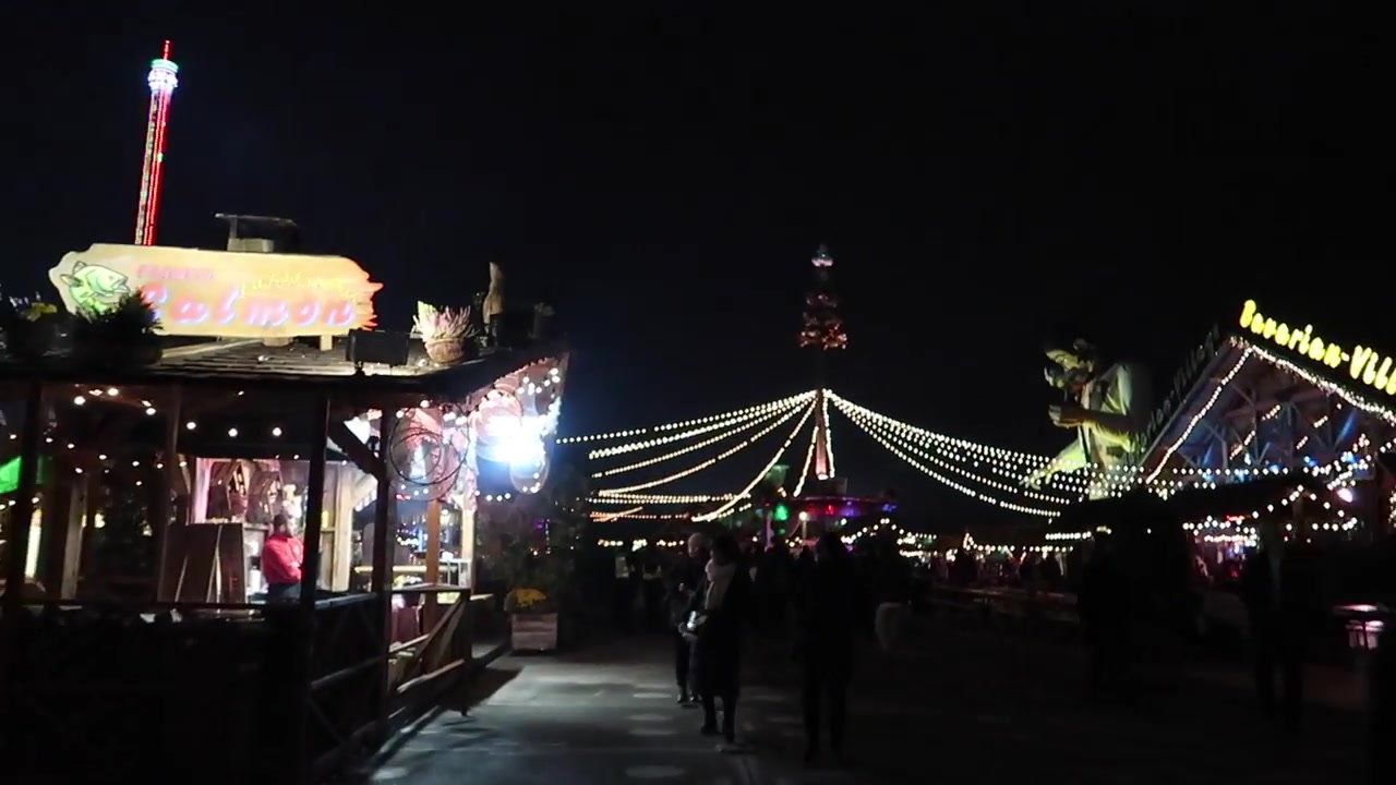 Wooden stalls and strings of lights in the Bavarian Village