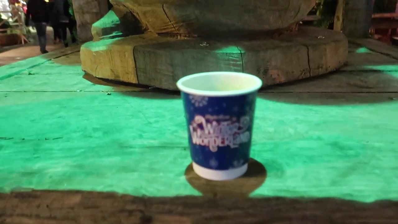 Cup of mulled wine on a wooden table at Winter Wonderland
