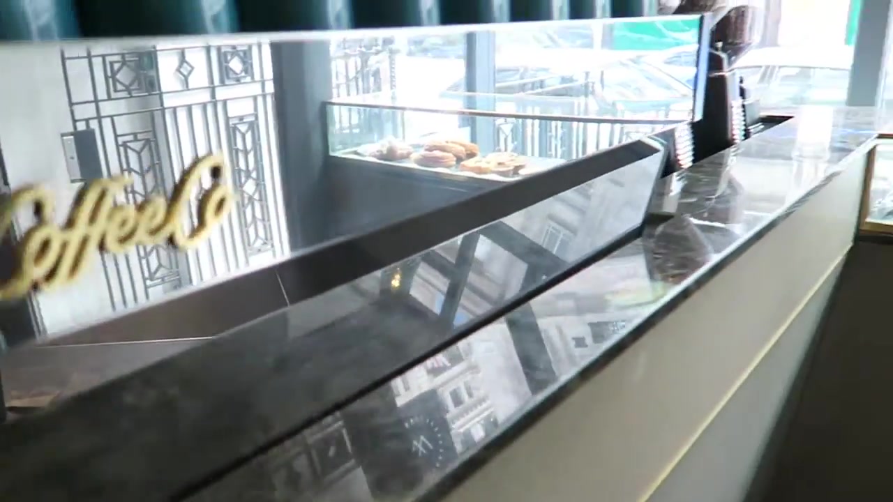 Coffee counter and food display inside Workshop Coffee Fitzrovia