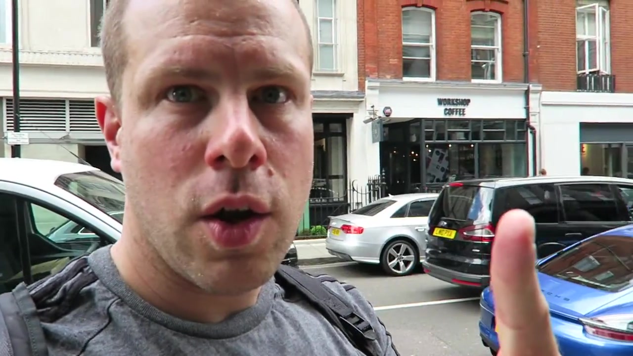 Barry outside Workshop Coffee Fitzrovia with the café entrance across the street