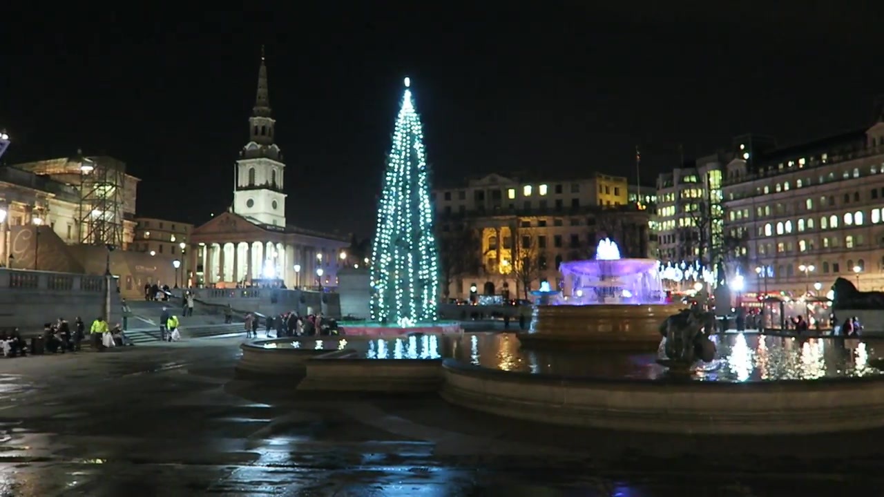 Trafalgar Square Christmas tree beside the illuminated fountain and St Martin-in-the-Fields in 2015.