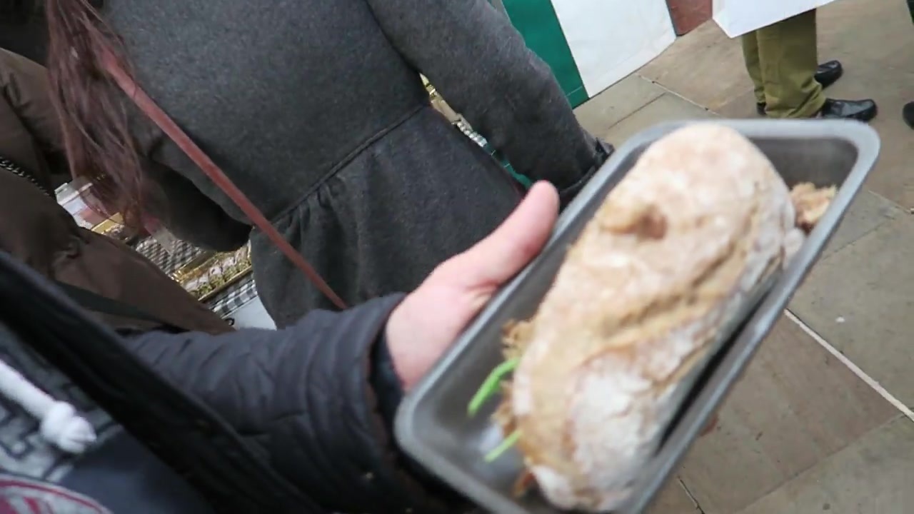 Duck confit sandwich from Partridges held on a tray