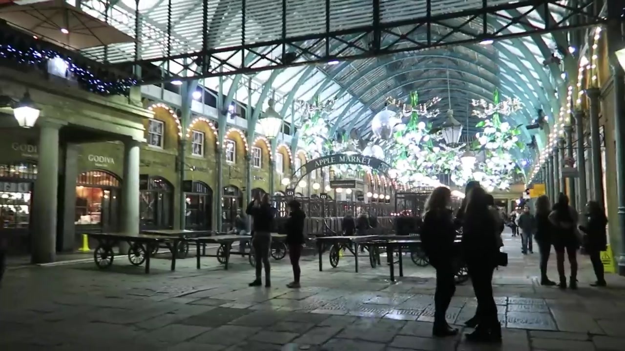 Christmas lights and mistletoe decorations beneath the Covent Garden Market roof.