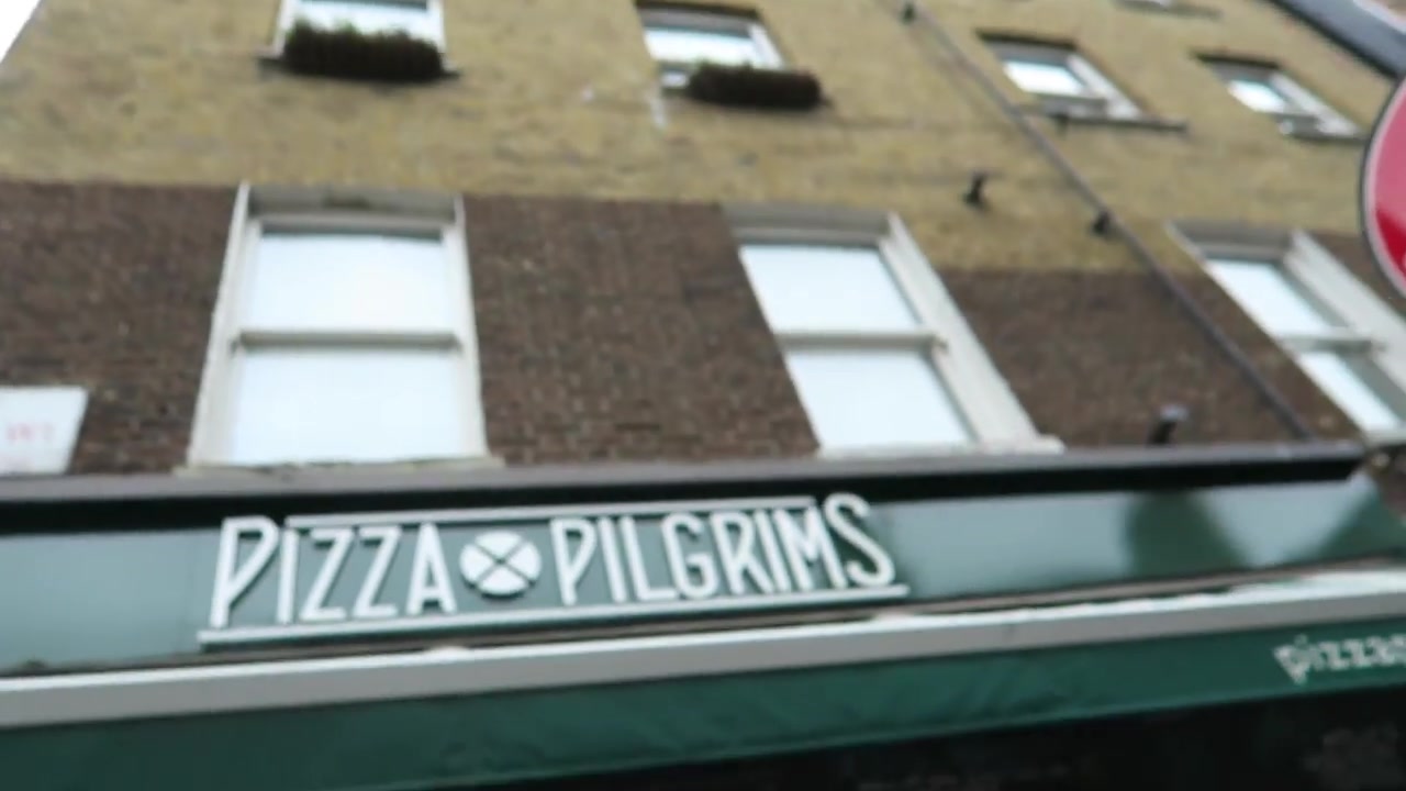 Green Pizza Pilgrims awning beneath the Dean Street building