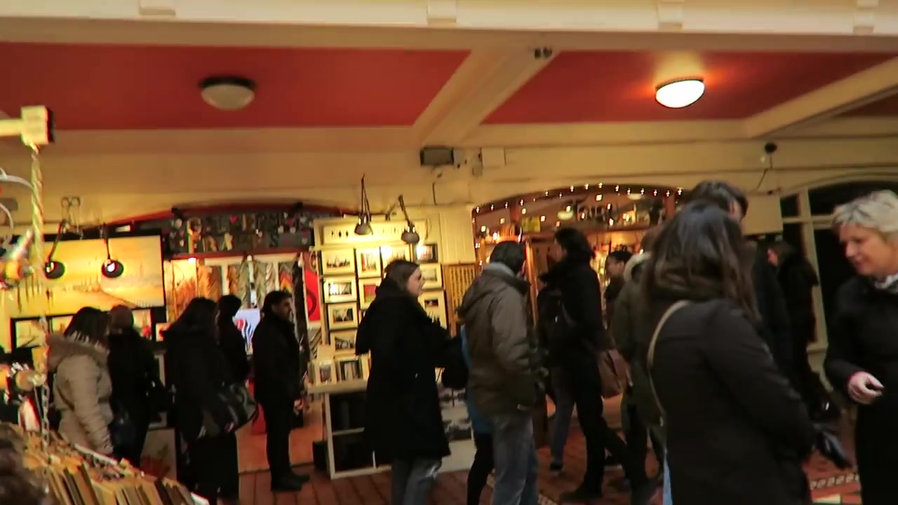 Market stalls beneath the red-painted ceiling inside Camden Market