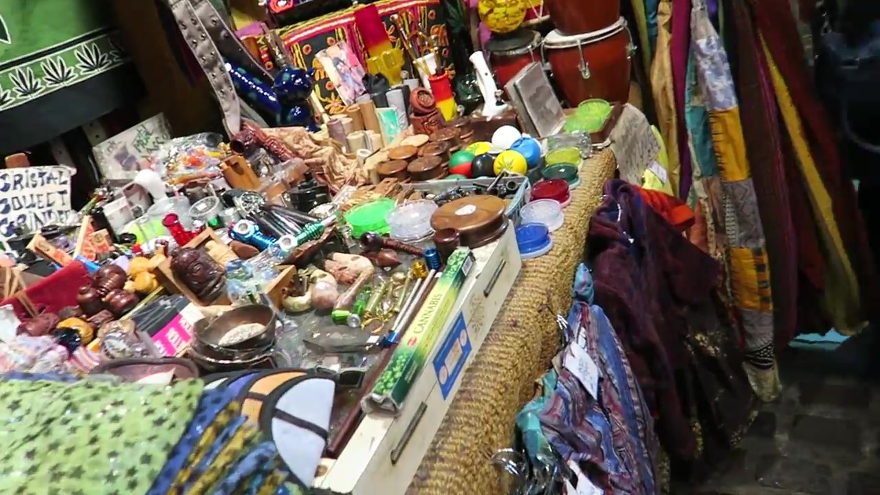 A Camden market stall packed with small decorative objects and colourful gifts.