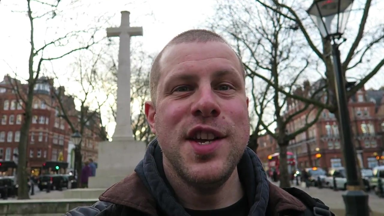 Barry in Chelsea beside the war memorial at dusk