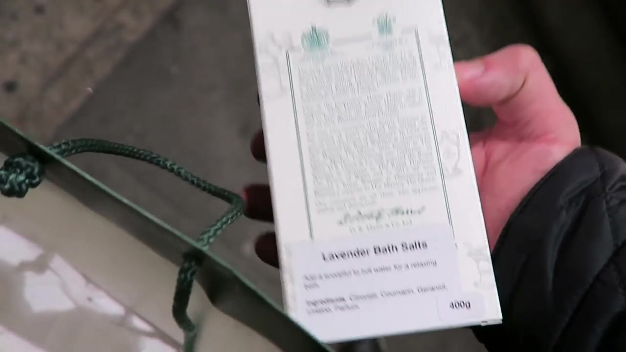 D.R. Harris lavender bath salts packaging held outside the shop